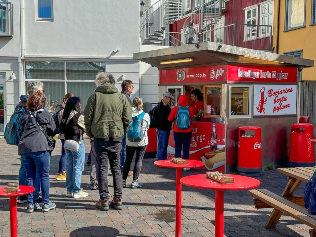 Queuing for Hot Dogs at a European Street Stand