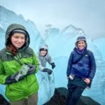 Puffins A family taking pictures on a glacier with stunning ice formations in the background.