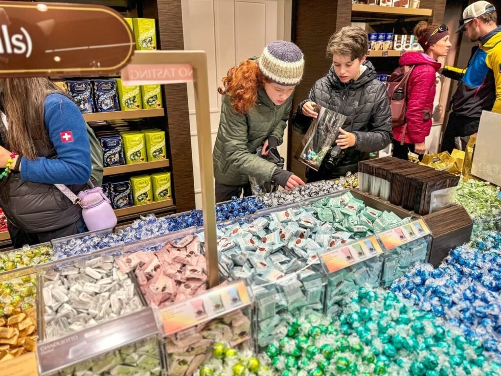 Visitors browse a colorful display of candies and meringues in a shop in the Pacific Northwest.