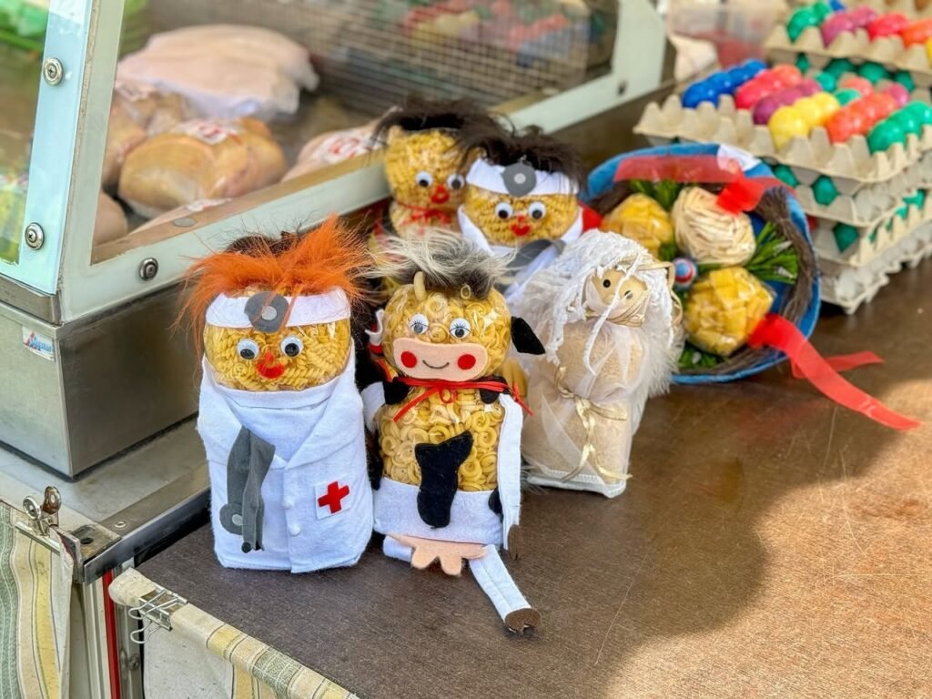 A collection of handmade Dr. Seuss character stuffed animals displayed at an outdoor market stall.