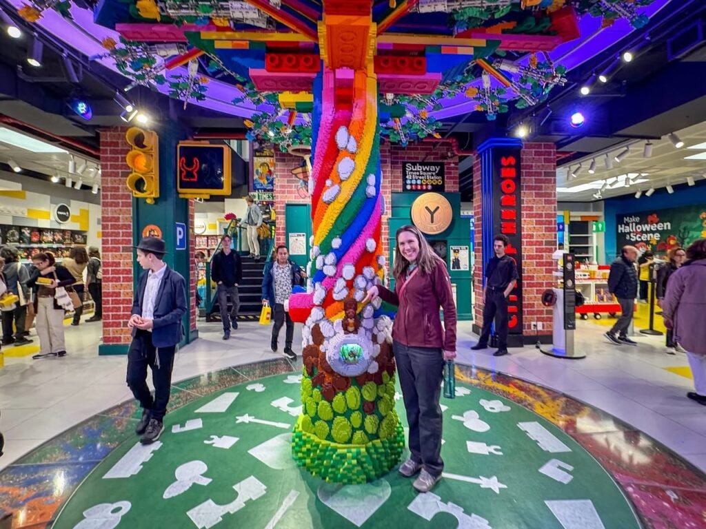 People enjoy a colorful mini golf course decorated with whimsical pineapple-themed art.