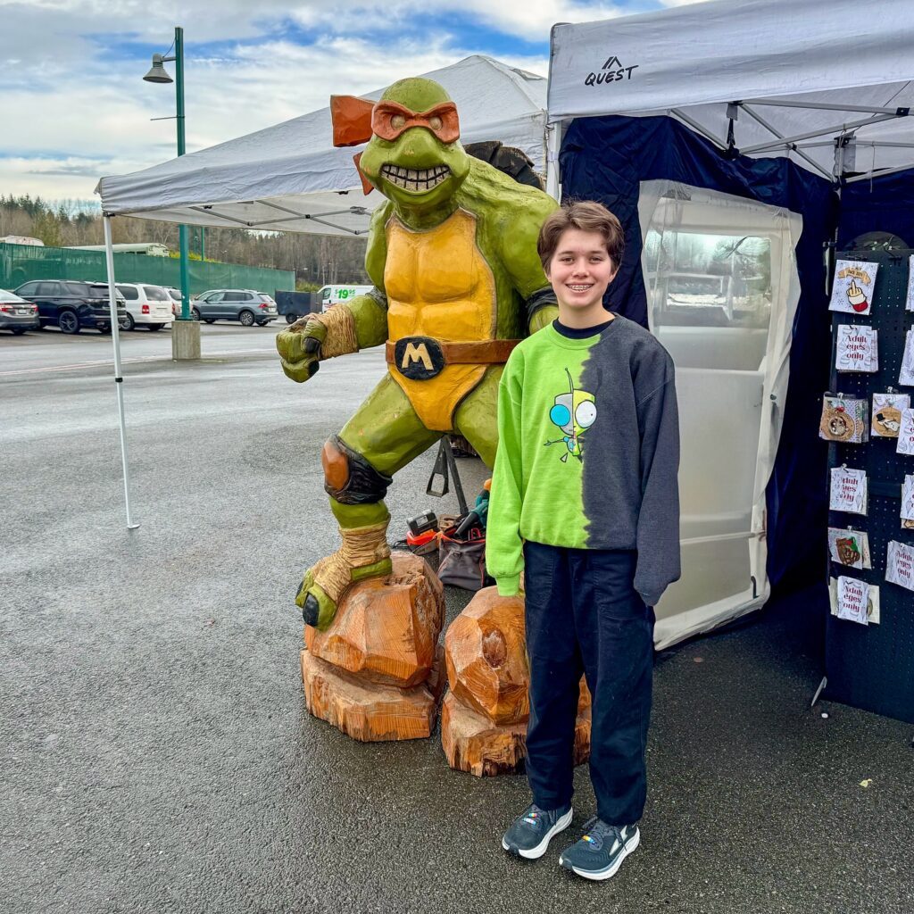 Posing With a Turtle Statue at the Fair