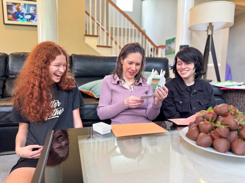 People enjoying a card game together in a cozy living room.