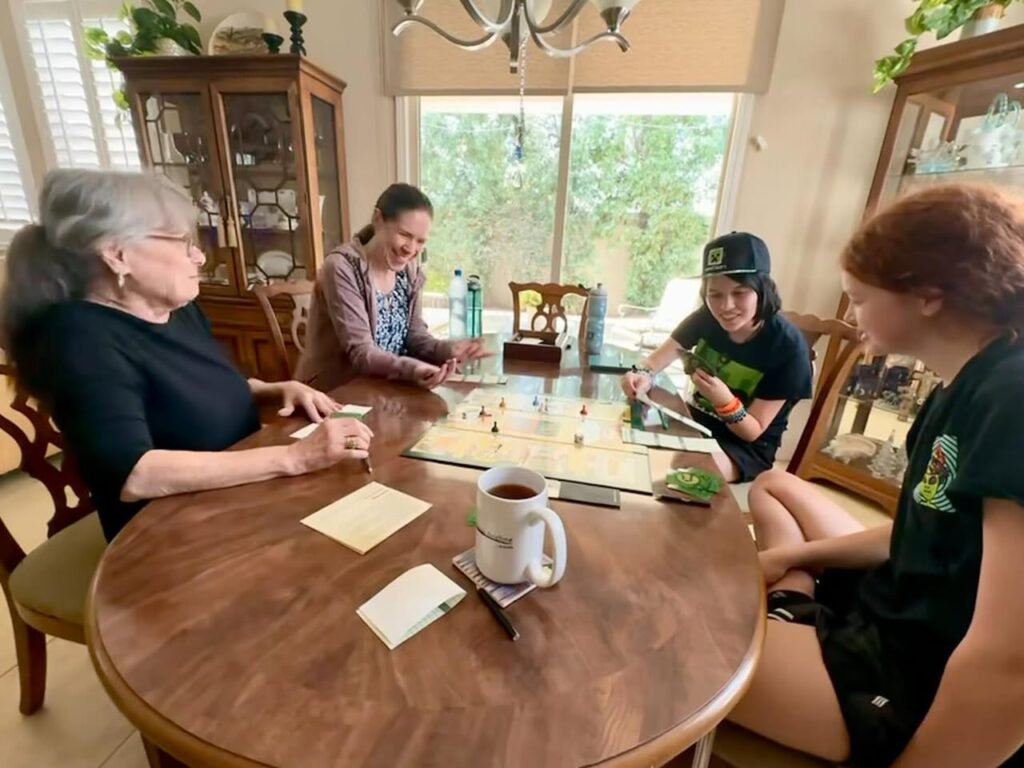 People gathered around a table playing a game.