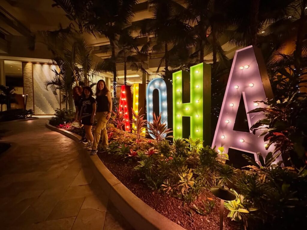 Colorful Marquee letters spelling L-O-U-I-S-I-A-N-A inside a glowing hotel lobby.