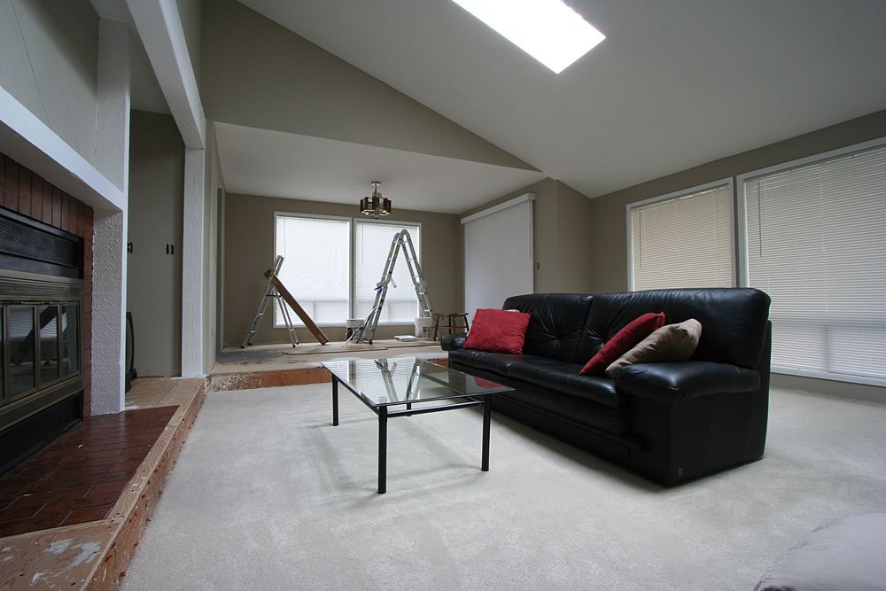 Modern Living Room with Black Sofa and Glass Coffee Table