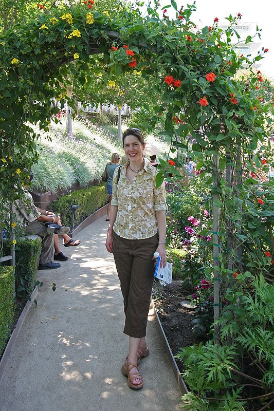 Kristie poses in a garden center while visiting the Bloedel Reserve.