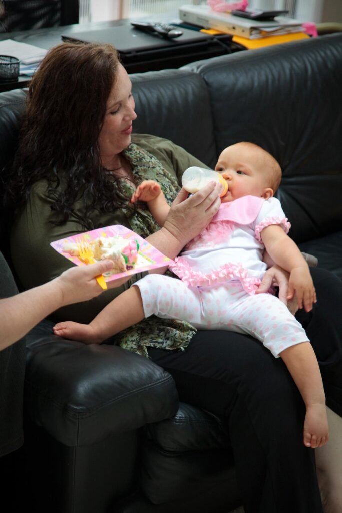 Mom Gives Baby First Meal