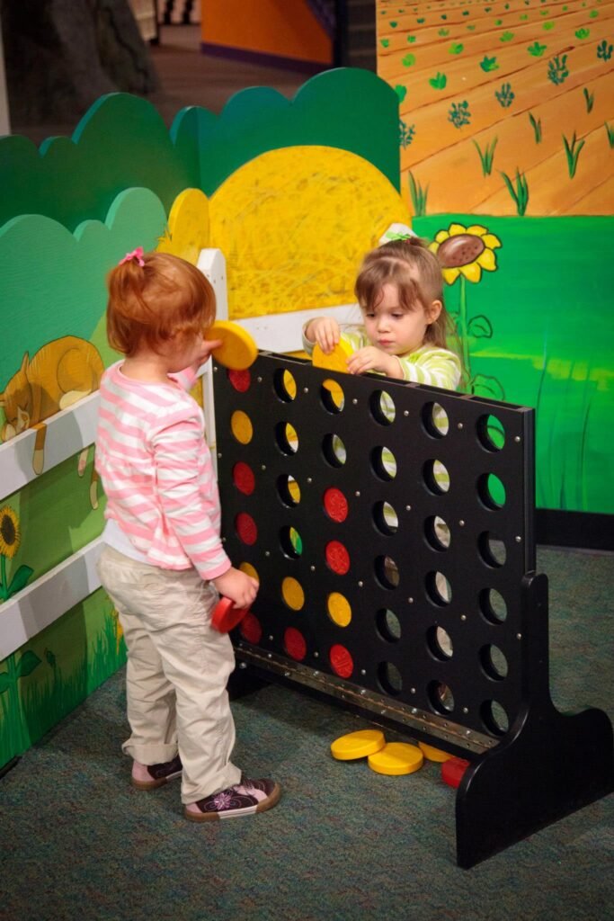 Children playing a giant Connect Four game at the Children's Museum of Tacoma.