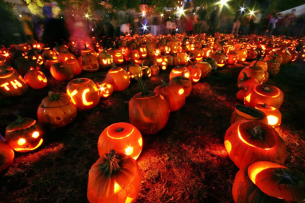 Nighttime display of glowing jack-o'-lanterns