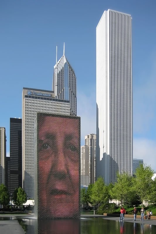 Buckingham Fountain in Chicago with a composite image of a face on the pedestal.