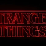 A detailed view of the Stranger Things logo in red neon. The image highlights the classic serif font and retro styling.
