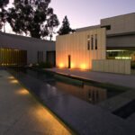 Balboa Park A historic château perched on a hill with a sunset backdrop and lush greenery
