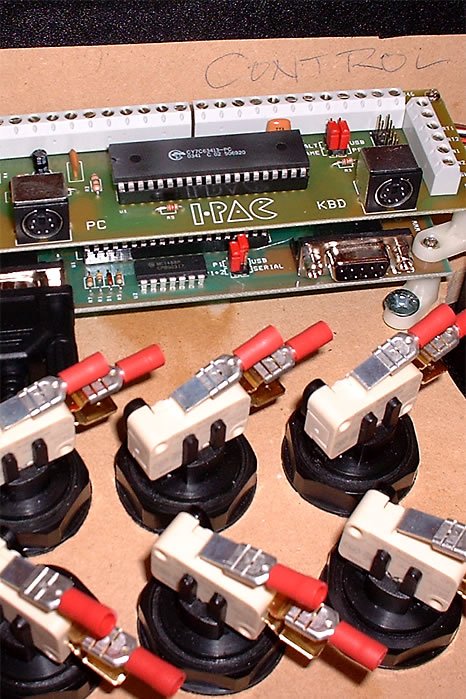 A close-up view of a homemade computer keyboard circuit with various electronic components.
