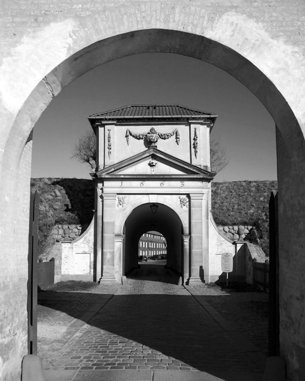 A striking black-and-white photo showing nested arches, each framing the one beyond.