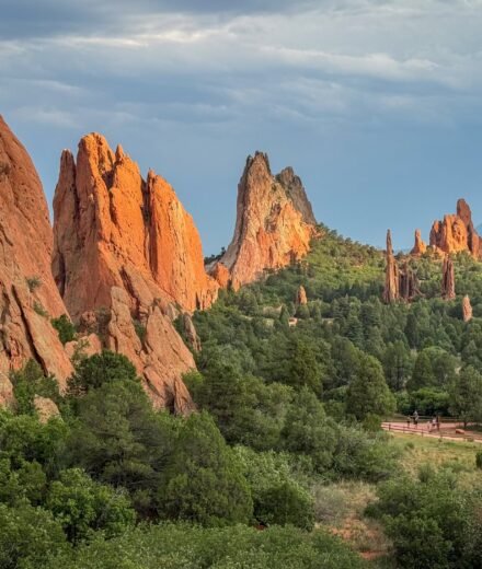 Dramatic red rock formations and lush greenery at Garden of the Gods.