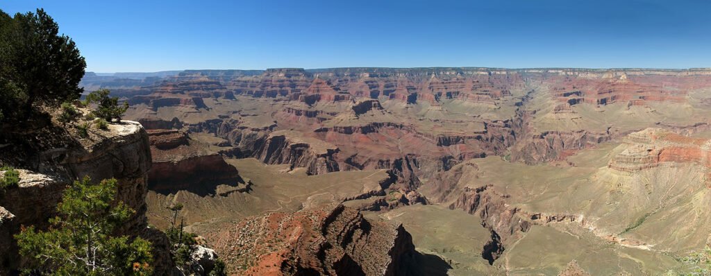 Panoramic view of the Grand Canyon with a clear blue sky