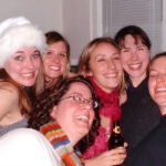Mt. Pilchuck A group of smiling friends celebrating a holiday gathering together.