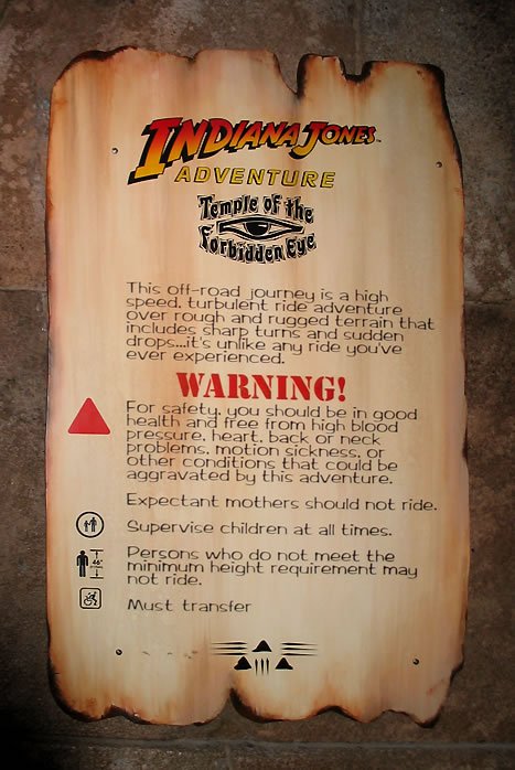 A scroll-style sign detailing safety warnings and ride information for the Indiana Jones Adventure: Temple of the Forbidden Eye.