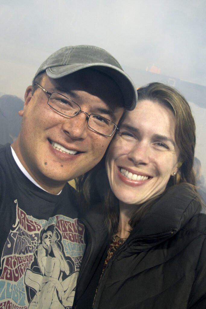 John and Kristie, two inseparable lovebirds, smiling and enjoying their time together in the Pacific Northwest.