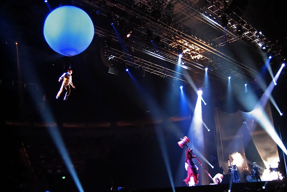 Live concert with inflatable globe and illuminated stage, bringing joy to Pacific NW music lovers
