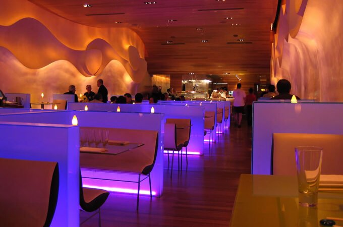 A stylish restaurant featuring modern design and ambient lighting.