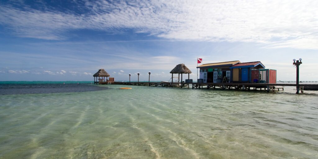 Colorful stilt house overlooking clear blue waters in Redang Island, Malaysia.