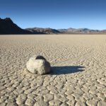 Eureka Dunes A lone sailing stone rests on the cracked mudflats of Racetrack Playa in Death Valley National Park. Photo by johnandkristie.com