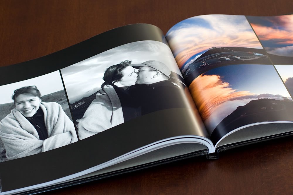 Open photo album showing a smiling woman and the Seattle skyline.