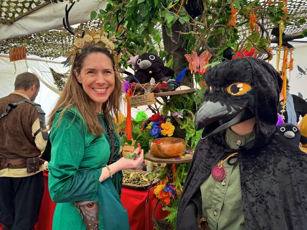 Close-up of a person in a raven costume at a festival