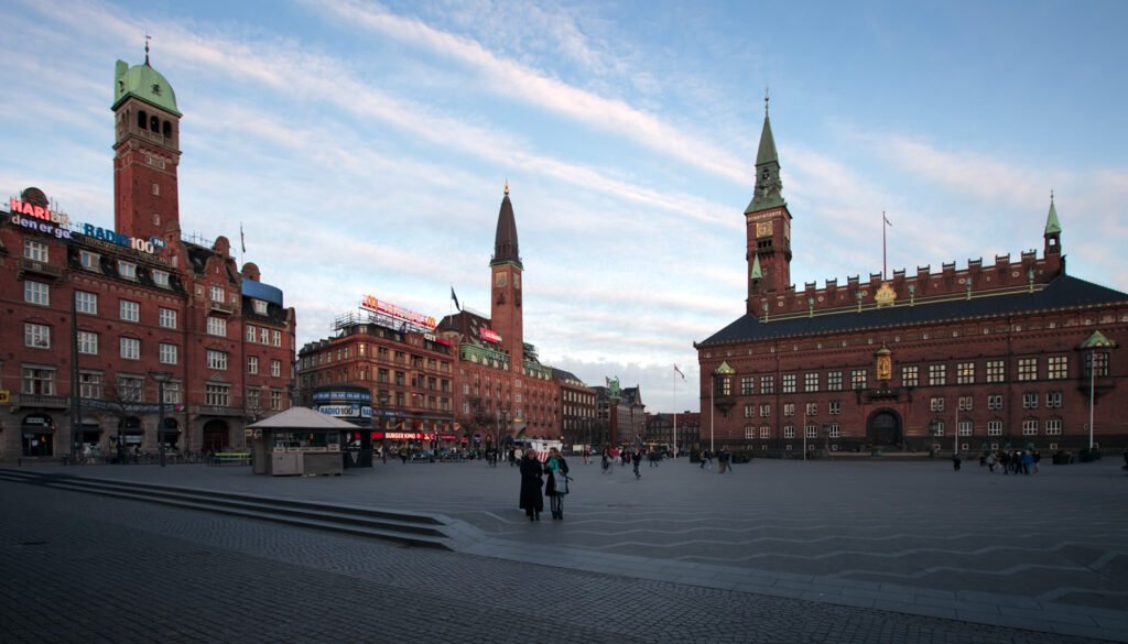 View of Stockholm's red brick buildings and Town Hall under a clear sky.