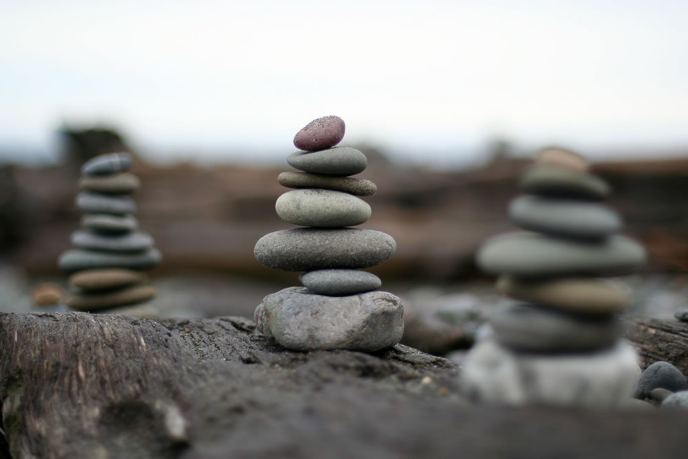 Imaginative rock stacks along the serene coastline, reflecting the beauty of our Pacific Northwest travels.