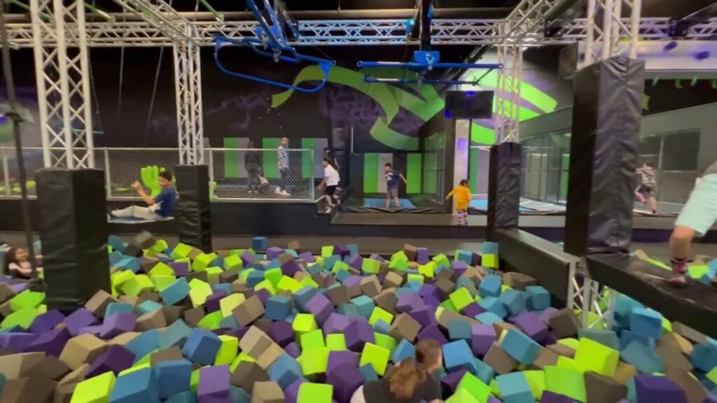 A fun indoor trampoline park with multi-colored foam pits and activities for all ages.