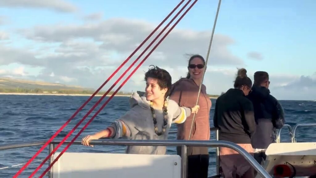 Family enjoying a day aboard a sailboat in the Pacific Northwest