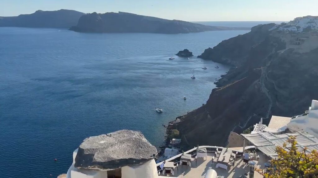 Stunning aerial view of the Santorini caldera with traditional buildings on the cliffs.